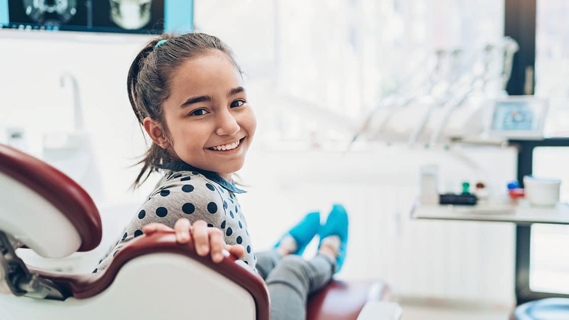 Smiling Child in Dental Chair